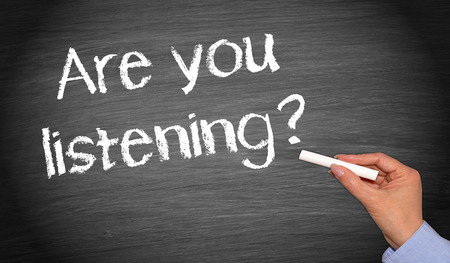 words are you listening written on a chaulk board